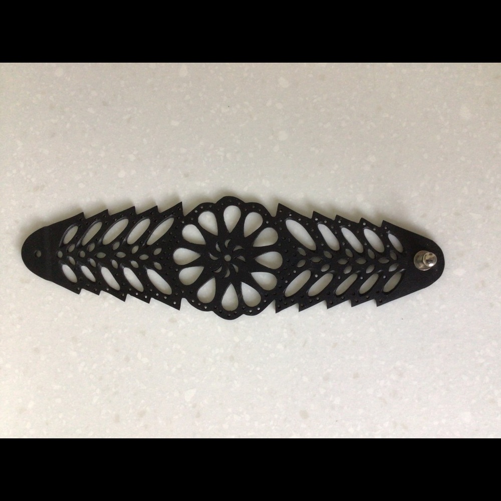 Women’s laser cut vinyl bracelet.